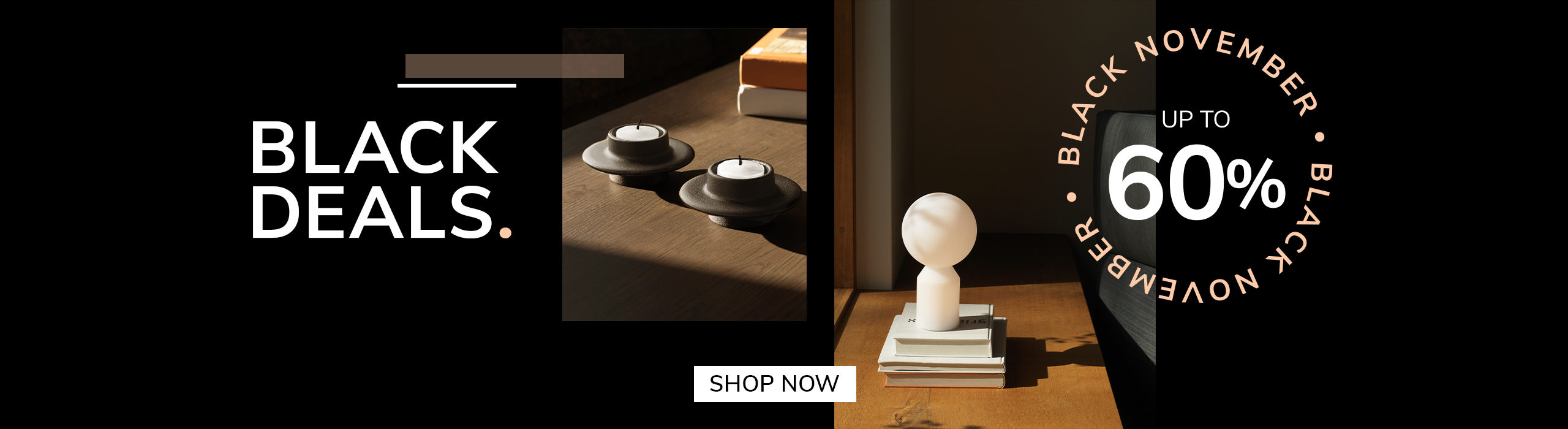 Modern interior scene with a small sculptural table lamp on stacked books and minimalist candle holders on a wooden table, promoting Black November deals with up to 60% off.